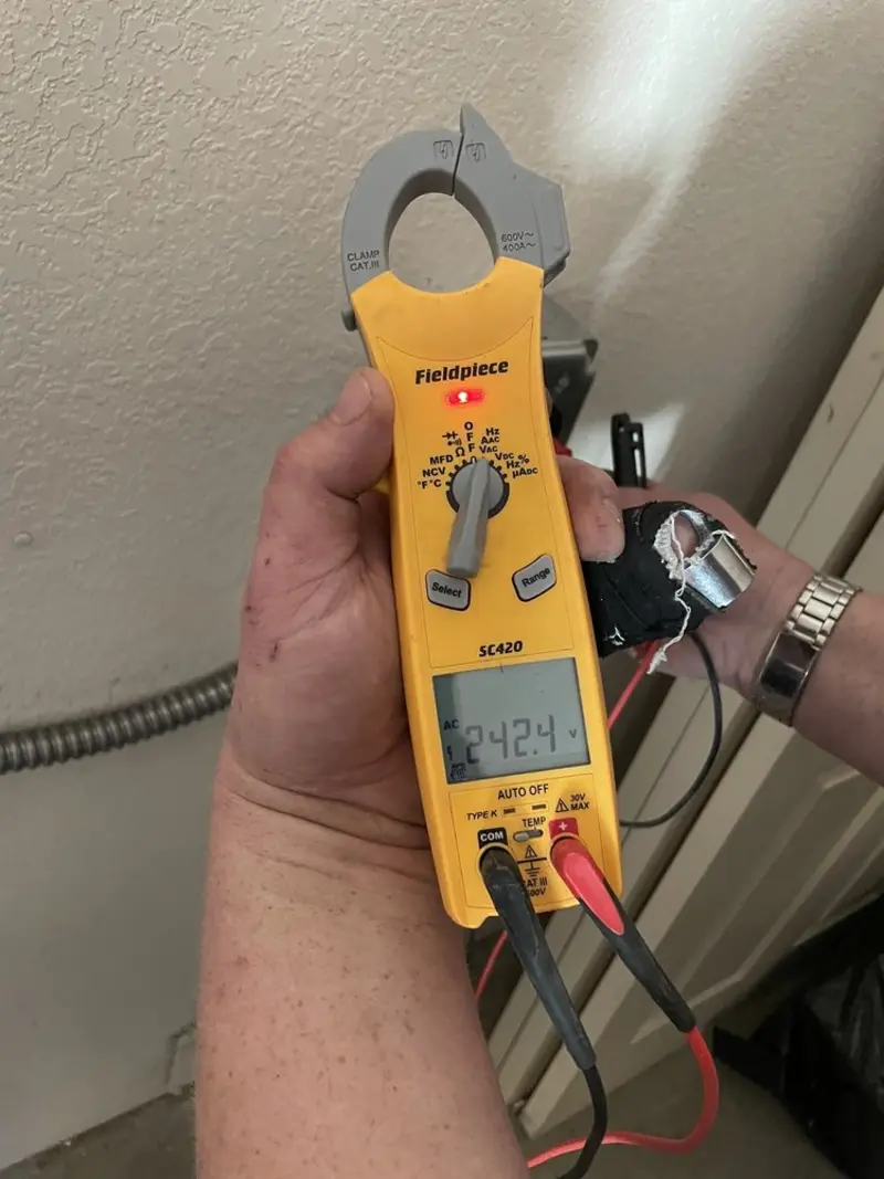 Voltage testing with clamp meter during Whole House Surge Protector in Washington